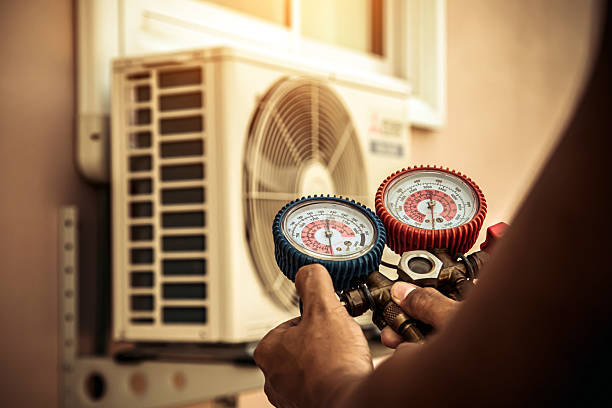 Professional Heat Pump Repair technician working in Newton, KS
